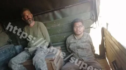 Bức ảnh hai lính Mỹ bị Nga bắt được đăng tải trên Telegram (Ảnh: QQ).
