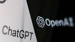  Logo OpenAI trên màn hình điện thoại của trang web ChatGPT trên màn hình máy tính xách tay (Ảnh: Getty)