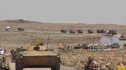 Quân đội Syria hành quân trên chiến trường sa mạc Suwayda. Ảnh minh họa video Quân đội Syria