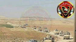 Trạm kiểm soat quân sự Syria chặn đường hành quân của đoàn xe quân sự Mỹ. Anh Muraselon