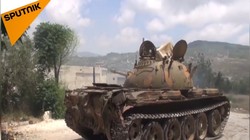 Quân đội Syria pháo kích trên chiến trường Latakia. Ảnh video Sputnik