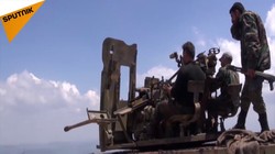 Lực lượng Hồi giáo cực đoan sẵn sàng cho cuộc chiến với quân đội Syria ở Lattakia. Ảnh minh họa video Sputnik.