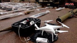 Vũ khí và máy bay trinh sát không người lái UAV, được thu giữ tại Daraa. Ảnh: SANA.