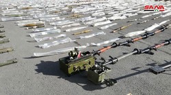 Các loại vũ khí đạn dược thu giữ được trên vùng ngoại ô Damascus. Ảnh SANA