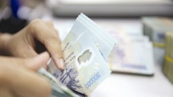 Việc cơ cấu lại TCTD bằng hình thức phá sản được cho là một hình thức răn đe, là động lực để các TCTD nâng cao chất lượng quản trị điều hành và trách nhiệm trong việc sử dụng nguồn tiền huy động. Ảnh: THÀNH HOA