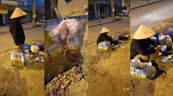 Người phụ nữ ngồi cắt khẩu trang đã sử dụng trong các đống rác