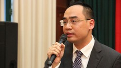 Vụ trưởng Vụ Chính sách tiền tệ (Ngân hàng Nhà nước) -Bùi Quốc Dũng trả lời báo chí chiều 4/1về cơ chế tỷ giá mới. Ảnh:Anh Tú.