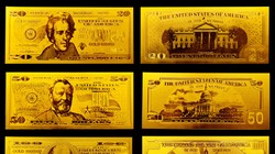 Tỷ giá thăng hoa, giá vàng dúi dụi