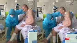 Những hình ảnh  mới nhất cho thấy bệnh nhân 91 đã có thể ngồi dậy, đung đưa chân, bắt đầu tập ăn qua đường tiêu hóa (Ảnh cắt từ clip) 
