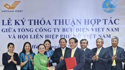 Lễ ký kết thỏa thuận hợp tác giữa Tổng công ty Bưu điện Việt Nam và Hội LHPN Việt Nam. Ảnh: MIC