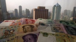 Ngân hàng Merrill Lynch thuộc Bank of America cho rằng nhân dân tệ sẽ có đợt giảm giá lớn nhất 20 năm qua trong năm 2016 - Ảnh: Reuters