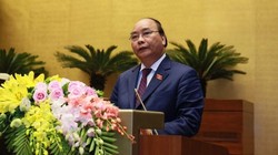 Thủ tướng Nguyễn Xuân Phúc trình bày báo cáo trước Quốc hội. Ảnh VGP/Nhật Bắc