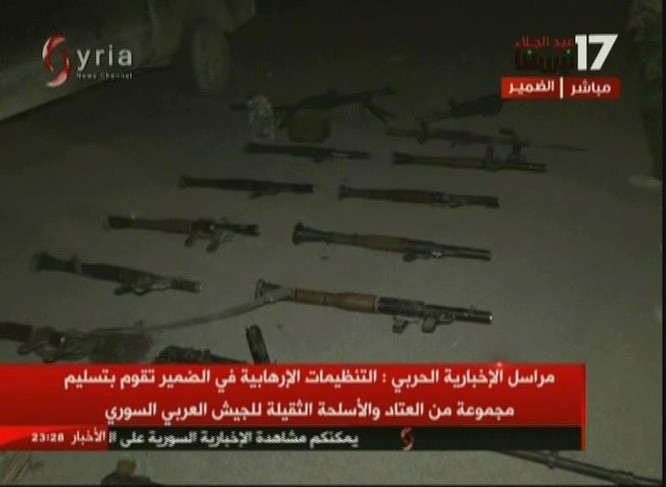 Chiến binh Hồi giáo lũ lượt xin hàng, giao nộp vũ khí cho quân đội Syria - ảnh 4