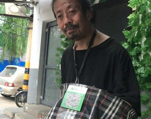 Giới ăn xin Trung Quốc ứng dụng QR Code như thế nào? Gioi an xin Trung Quoc ung dung QR Code nhu the nao?