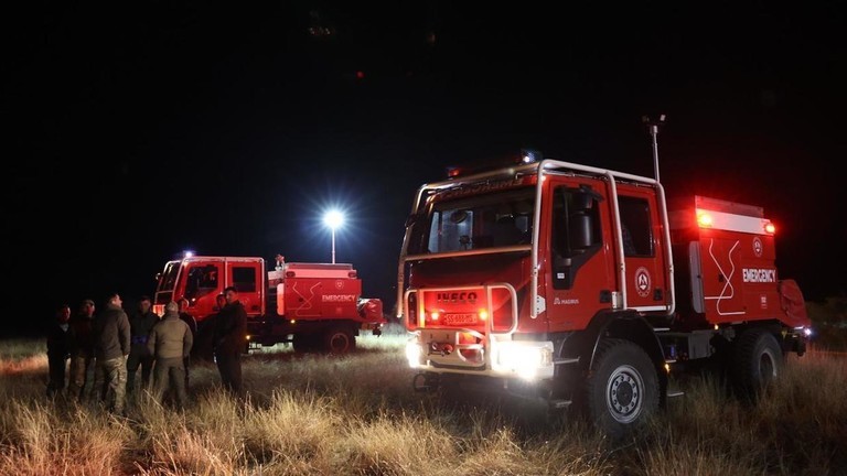 Các quan chức Gruzia tại hiện trường vụ rơi máy bay vận tải C-130 của Không quân Thổ Nhĩ Kỳ. Ảnh: Getty.