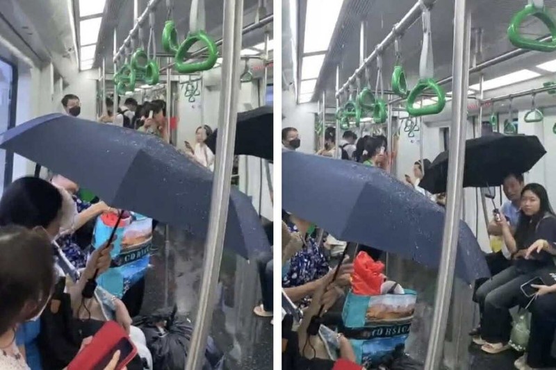 Hành khách hoảng hốt mở ô che chắn trong toa tàu vì nước chảy "tong tong". Anh 1.jpg