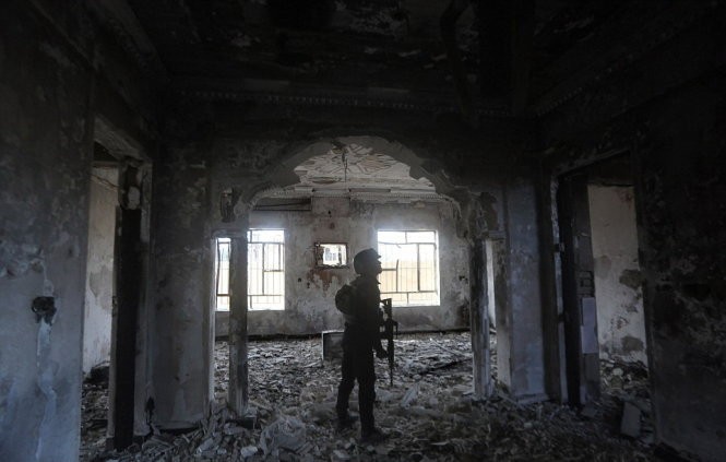 Một tòa nhà ở Ramadibị hư hại nặng sau nhiều tuần giao tranh kéo dài - Ảnh: AFP Một tòa nhà ở Ramadibị hư hại nặng sau nhiều tuần giao tranh kéo dài - Ảnh: AFP