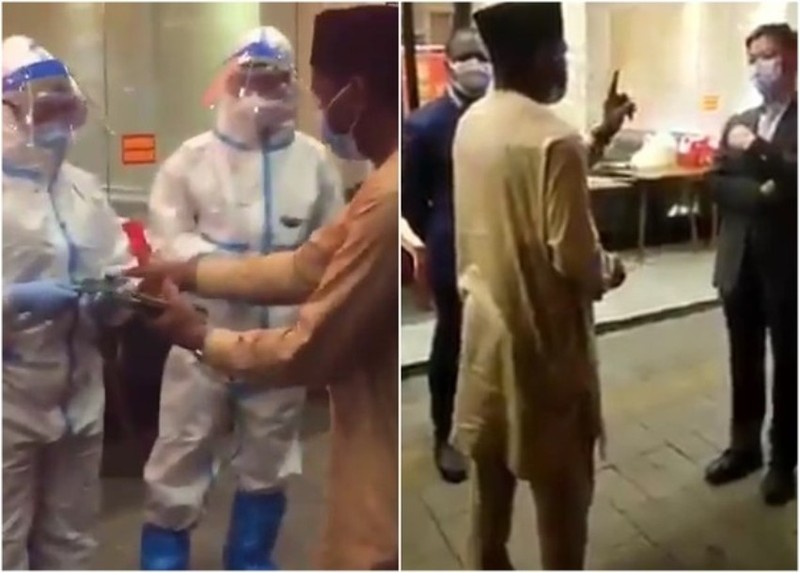 Đại diện Lãnh sự quán Nigeria tại Quảng Châu tranh cãi với các nhân viên công vụTrung Quốc đòi trả lại hộ chiếu họ đã tịch thu của các công dân nước ông (Ảnh: Đông Phương). Đại diện Lãnh sự quán Nigeria tại Quảng Châu tranh cãi với các nhân viên công vụTrung Quốc đòi trả lại hộ chiếu họ đã tịch thu của các công dân nước ông (Ảnh: Đông Phương).