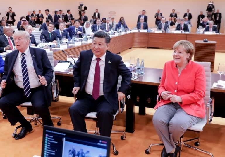 Tổng thống Mỹ Donald Trump, Chủ tịch Trung Quốc Tập Cận Bình và Thủ tướng Đức Angela Merkel tại Hội nghị Thượng đỉnh G20 ở Hamburg năm 2017. Ảnh: Reuters